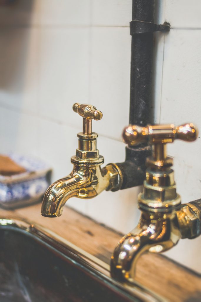 gold color faucets from kitchen sink
